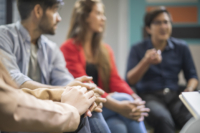 Three people in a therapy session.