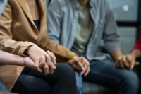 Two people holding hands.